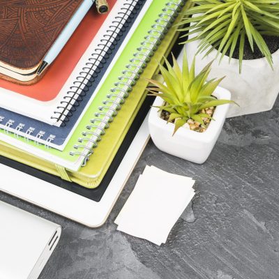 pile-notebooks-slate-background